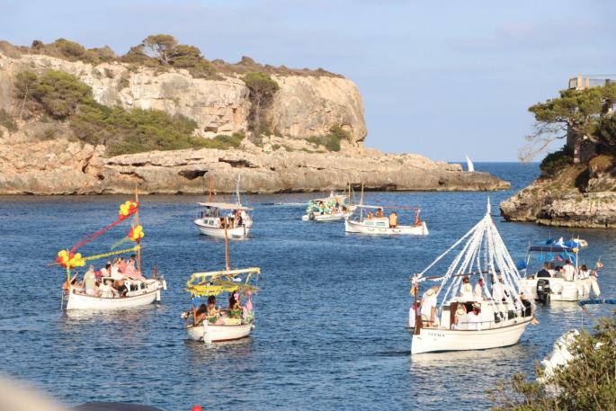 A scene from Cala Figuera with decorated boats