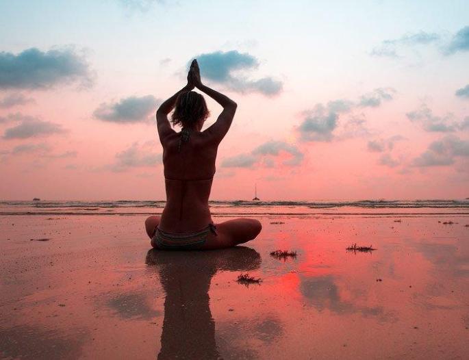 Doing yoga.