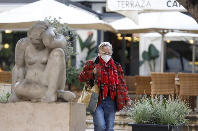 A person wearing a mask outdoors