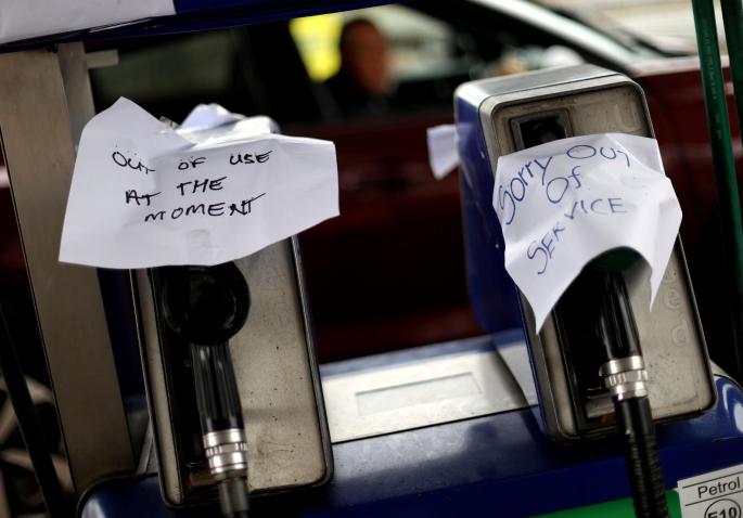 Signs show customers that fuel has run out at a petrol station
