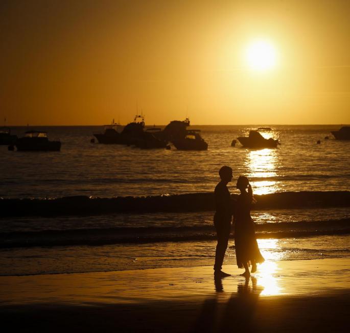 A couple seen on a beach