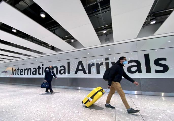 Travellers at Heathrow Airport
