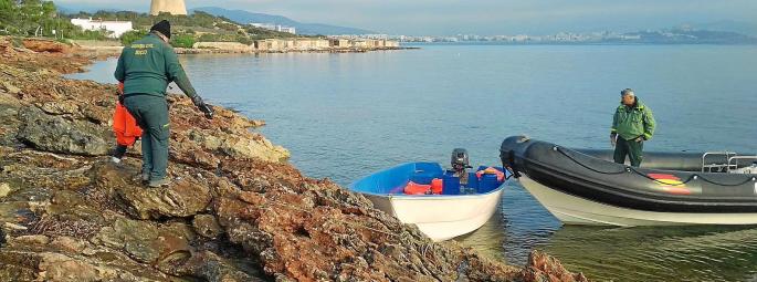 Guardia Civil with a migrant boat