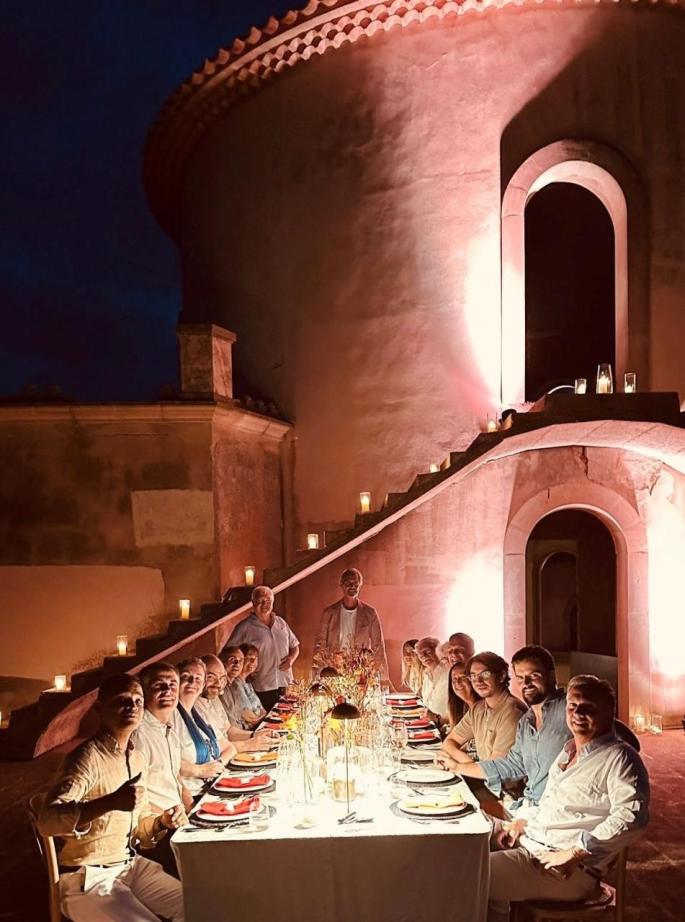 Guests at a dinner at John Barry's one-time mansion in Mallorca