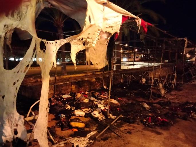 A stall deliberately set on fire at the fair in Alcudia, Mallorca