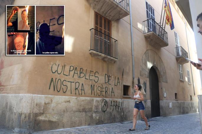 Graffiti on the wall of the tourism ministry building in Palma, Mallorca