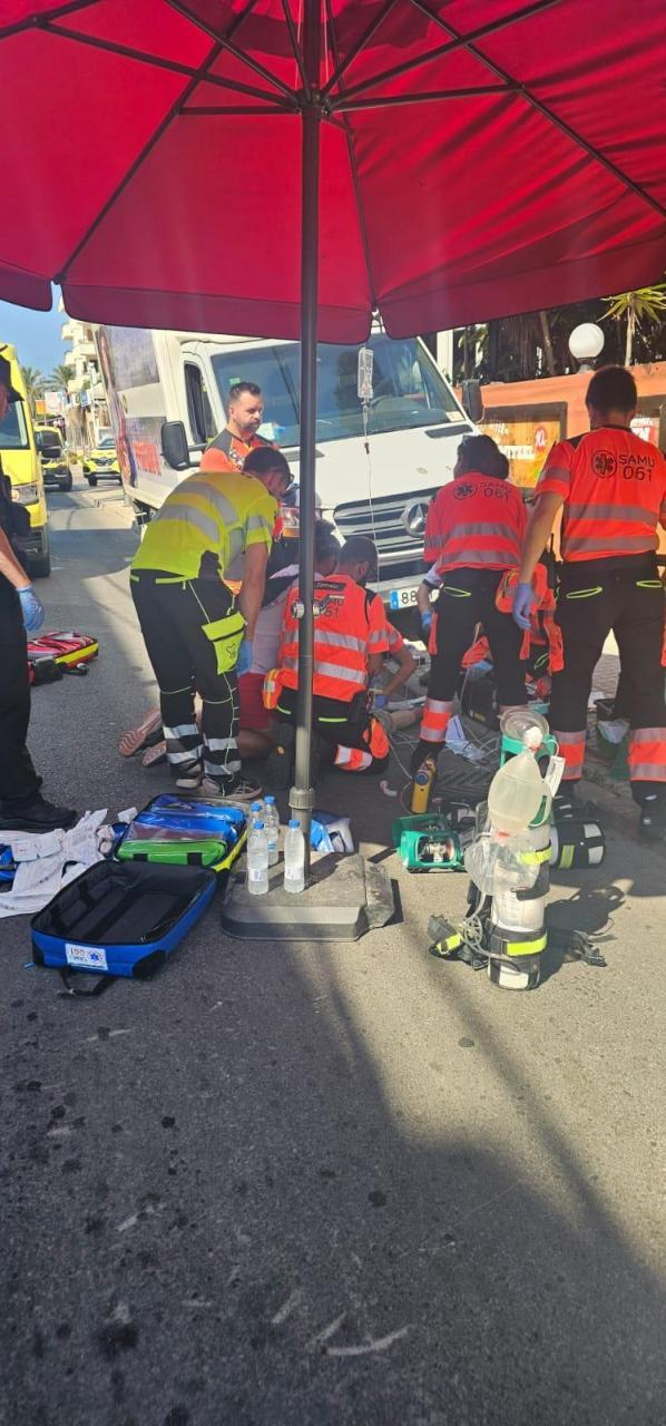 The emergency teams attending to the man at the scene.