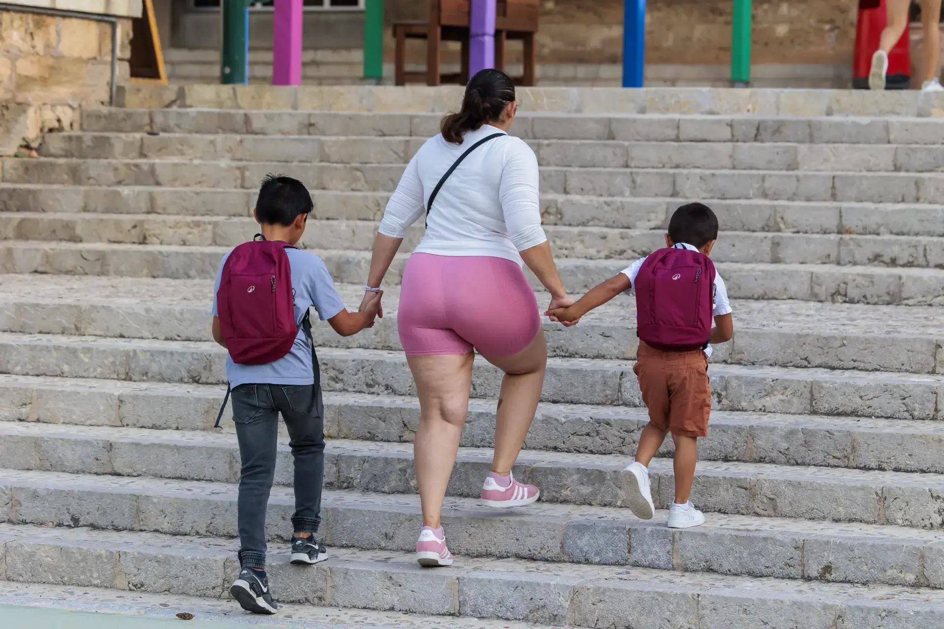 A mother in Mallorca taking children to school