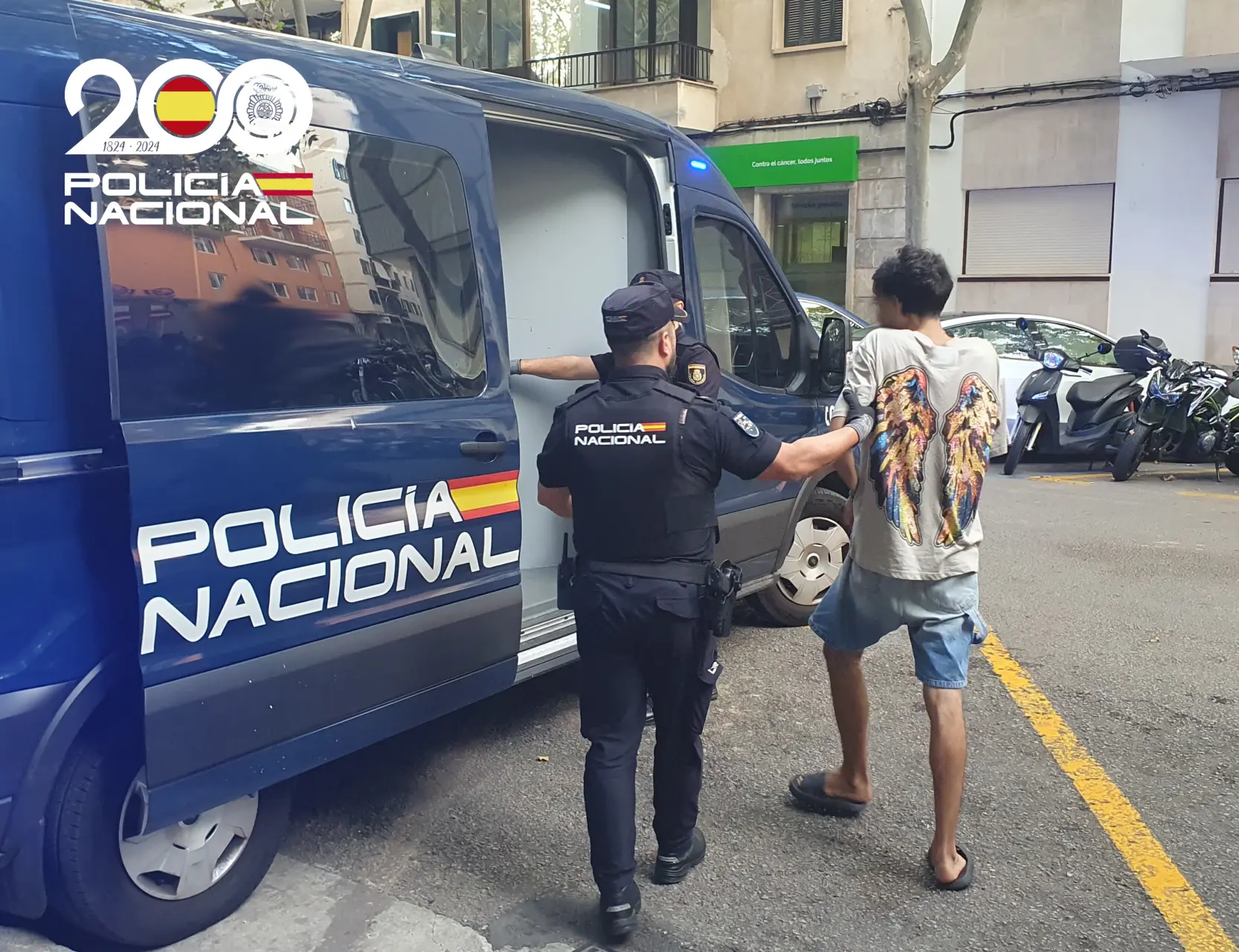 One of the suspects in police custody.