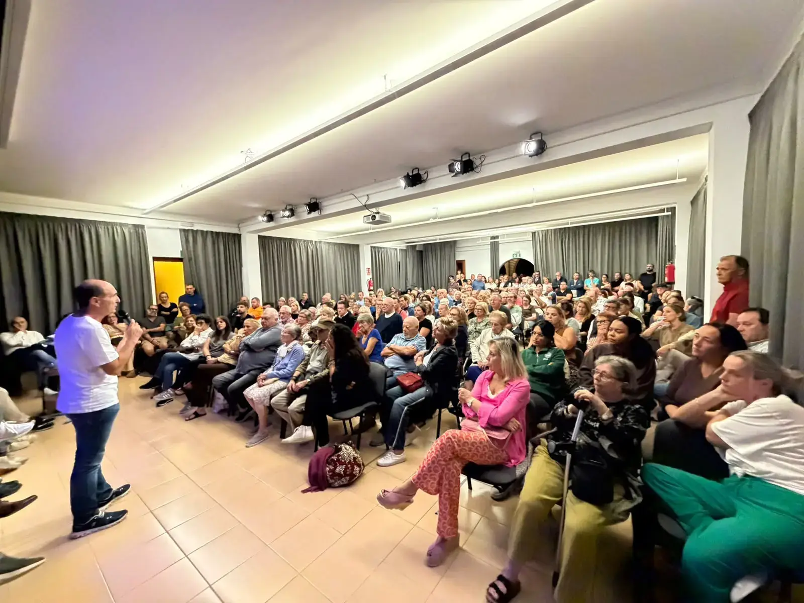 A packed parish hall in Puerto Pollensa, Mallorca