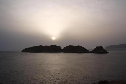 Haze over Mallorca caused by dust from the Sahara.