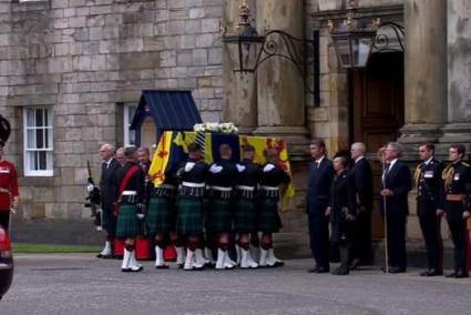 The Queen's coffin is carried into the Palace of Holyroodhouse