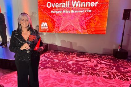 Margaret Whittaker OBE with her award