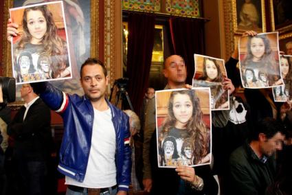 Ortiz with a poster of his daugher Malen.