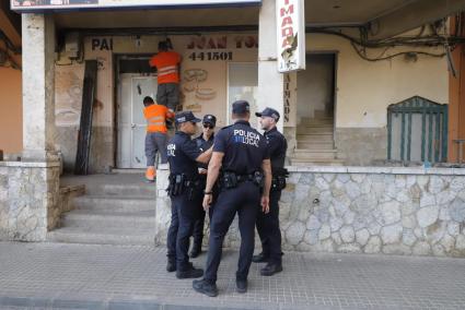 Police in Arenal, Mallorca at a building being boarded up