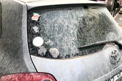 The sand storm covered cars in mud