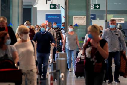 Tourists wearing face masks