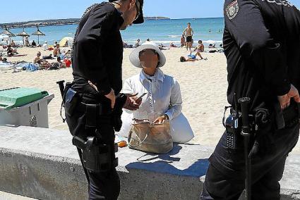 Playa de Palma police action against beach masseuses.