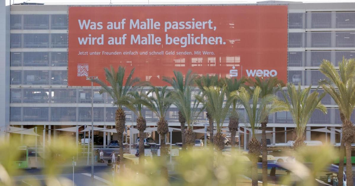 The Palma Airport advertising banner - The airports authority insists it does not promote tourism excess