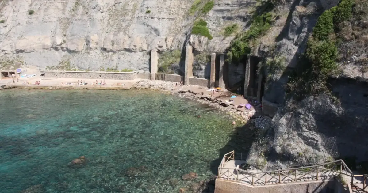 One of Mallorca’s most beautiful hidden coves features a freshwater waterfall and crystal-clear waters