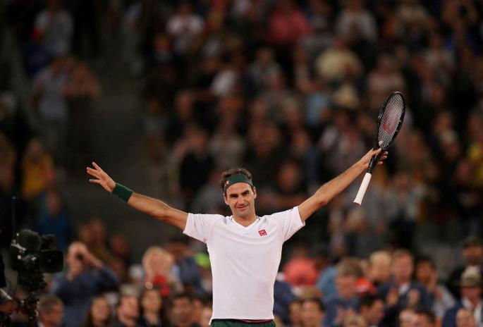 Roger Federer celebrates after winning an exhibition match against Rafael Nadal